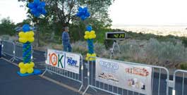 Runners climb uphill to the World's Longest Tram